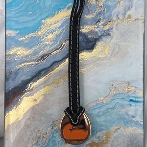 Dooney & Bourke Orange Duck hang tag